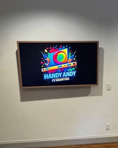 Samsung Frame TV with a wood bezel mounted flush like artwork