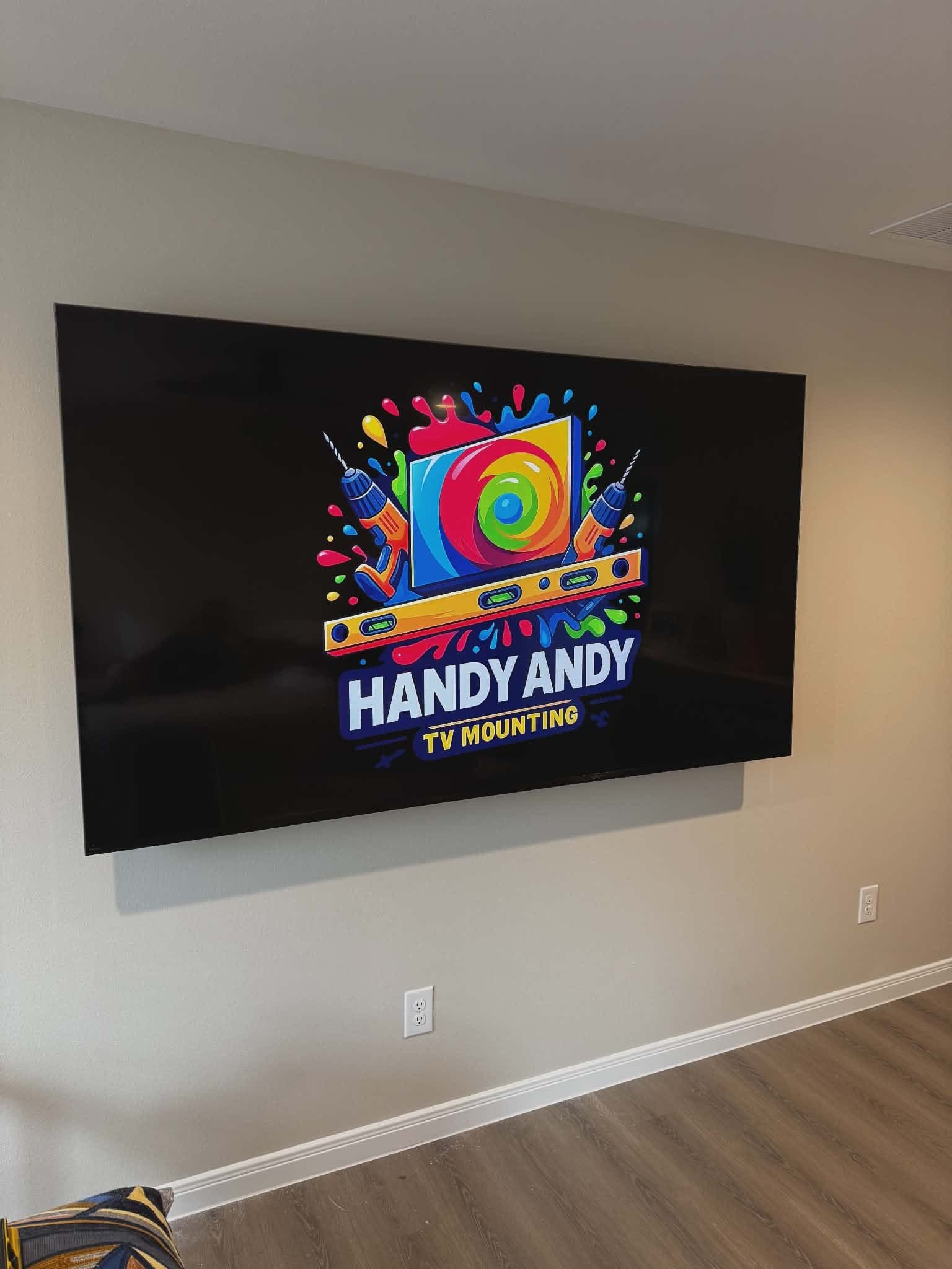 Large TV mounted level on a living room wall in Austin with no visible wires