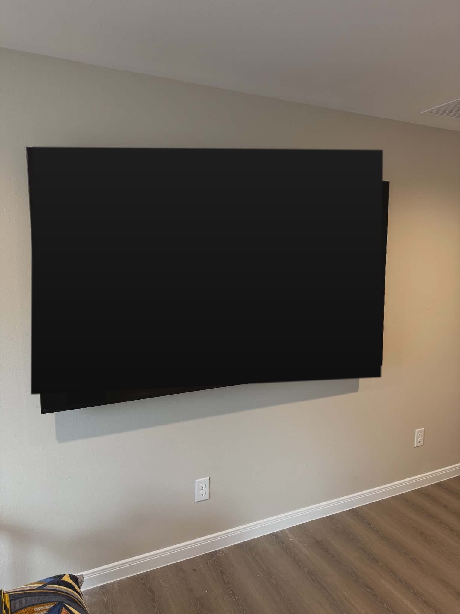 Wall-mounted TV with no visible wires in an Austin living room